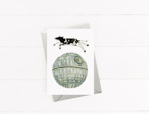 Cow Jumping Over The Death Star Card by Emily Mercedes