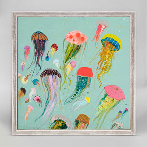 We love the pop of all these floating jellyfish. Vibrantly colorful they'll make you happy every day. Finished in our rustic white frame, this small artwork easily sits on your shelf or wall.