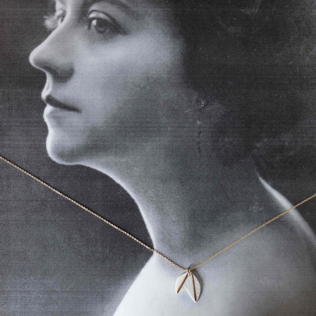 Our studio is in the great city of Austin, TX, and we make our jewelry from raw clay. To enhance the porcelain's beautiful and delicate whiteness, we incorporate design elements such as water-etching, the use of colored and metal glazes and lusters, and by sometimes incorporating other materials such as leather.