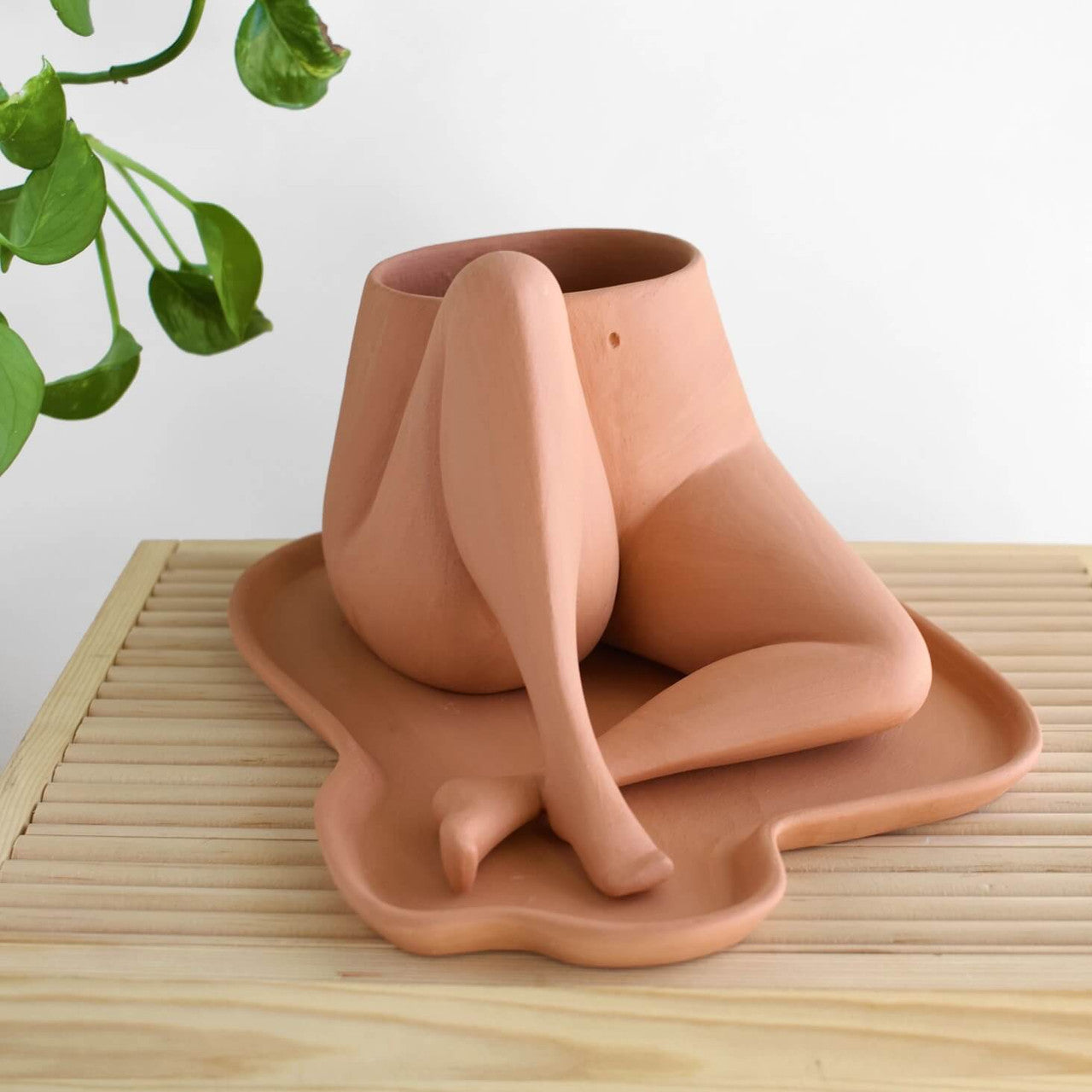 Leggy planters are created from a combination of plaster molds and handbuilding techniques.