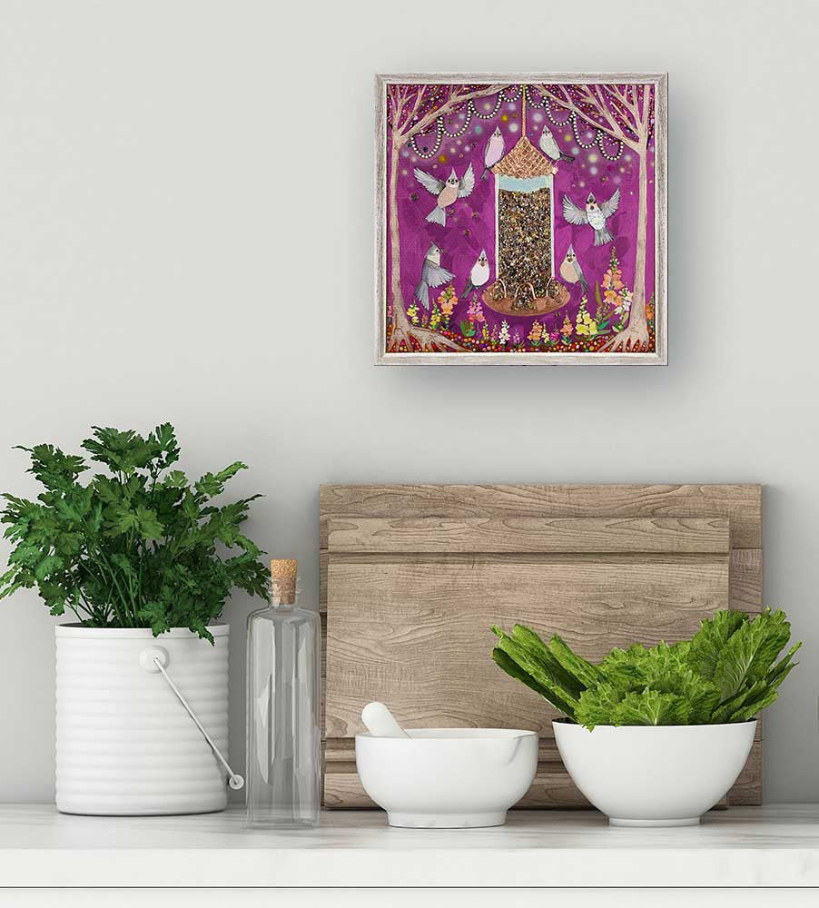 Flittering and twittering, these cheerful feathered friends, by Eli Halpin, enjoy a feast of seeds fit for a king. Finished in our rustic natural frame, this mini art sits easily on your shelf or wall.
