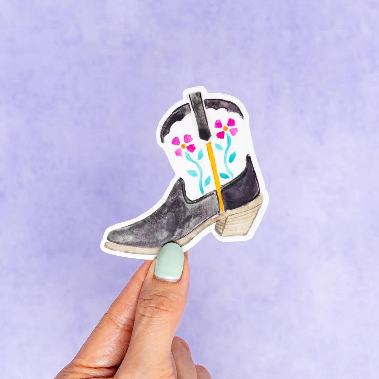 This fiesta floral black and white Texas cowboy boot vinyl sticker was created using a hand painted watercolor illustration of a cowboy boot by Kathy Phan from kathyphantastic. Bring back memories from Fiesta at the San Antonio Riverwalk.