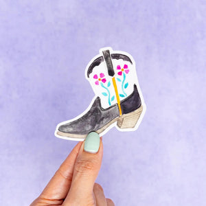 This fiesta floral black and white Texas cowboy boot vinyl sticker was created using a hand painted watercolor illustration of a cowboy boot by Kathy Phan from kathyphantastic. Bring back memories from Fiesta at the San Antonio Riverwalk.