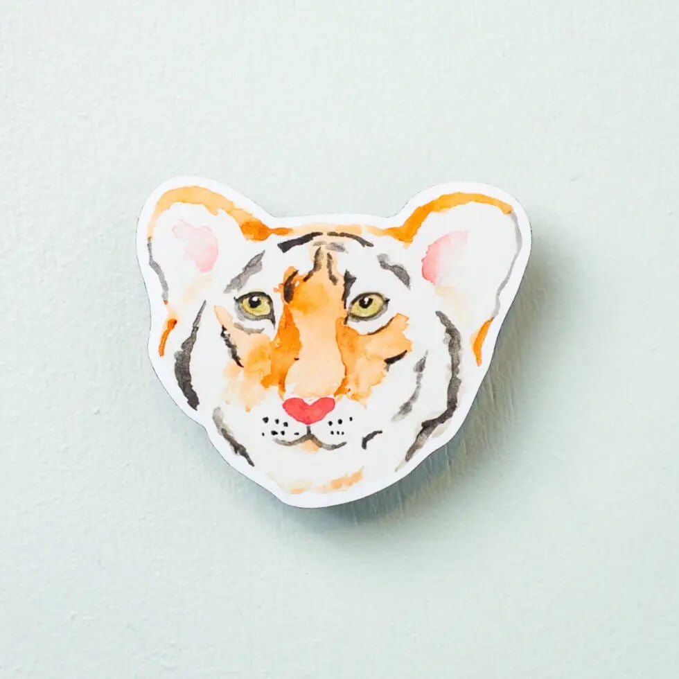 Tiger Sticker by Kathy Phan
Sticker size: 2.54" x 3"

This sticker is durable and waterproof. Show what you love on your laptop, water bottle, or anything!
Printed in USA