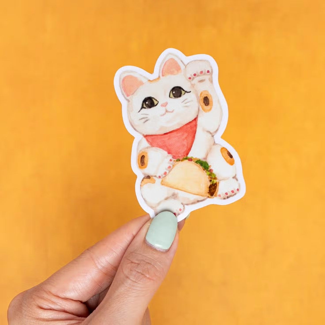 This Texas maneki lucky cat vinyl magnet was created using a hand-painted watercolor illustration by Kathy Phan from kathyphantastic. This matte vinyl cat magnet is waterproof.