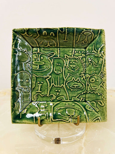 Small Green Pup Faces Ceramic Dish by Leila Levinson