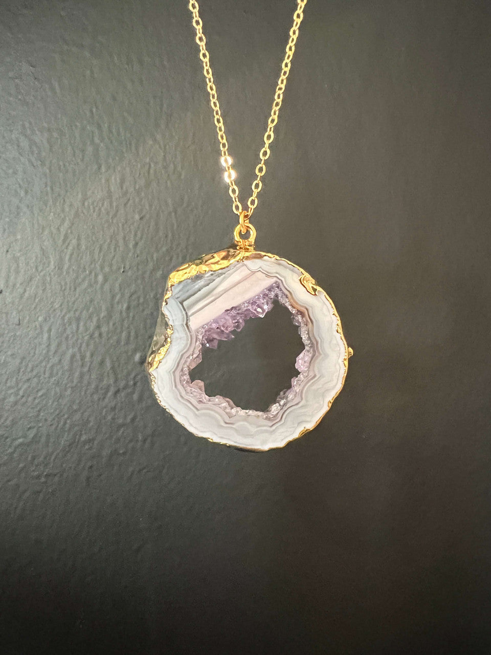 An electroplated Oco Agate with Amethyst crystal growth