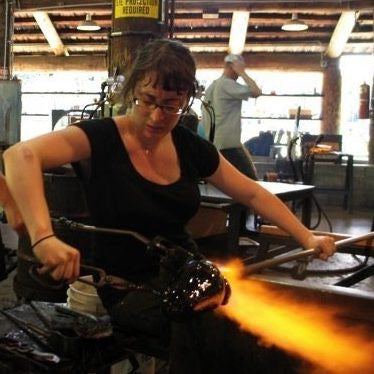 Get to Know the Austin Artist: 
Katie has been blowing glass since 2006 but she became fascinated with glass much earlier when she saw glass artisans working on the island of Malta at the age of 11.  After finding a public glassmaking studio years later in her hometown of Chicago, she tried her hand at making a cup and was instantly hooked.