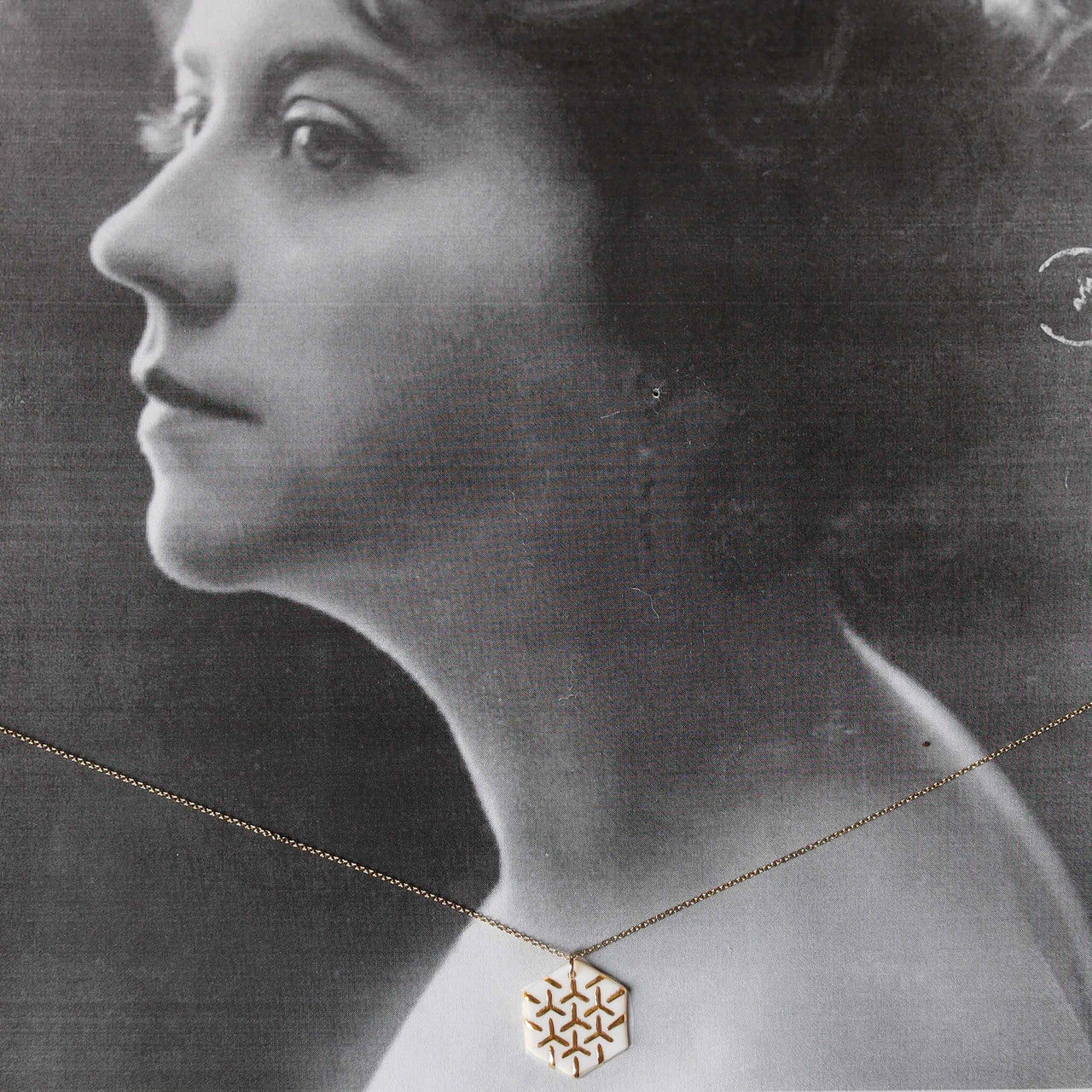 Barçelona Inspirada  created by Remnant Studios 
White & Gold Hexagon necklace