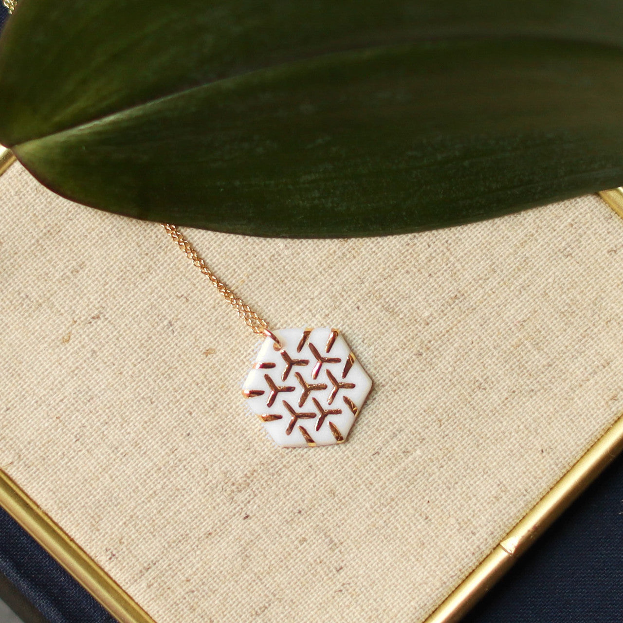 Barçelona Inspirada  created by Remnant Studios 
White & Gold Hexagon necklace